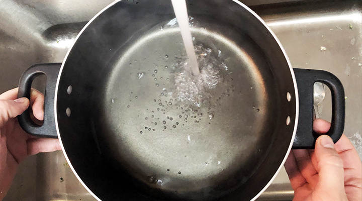 Fill a large pot halfway with water and boil.