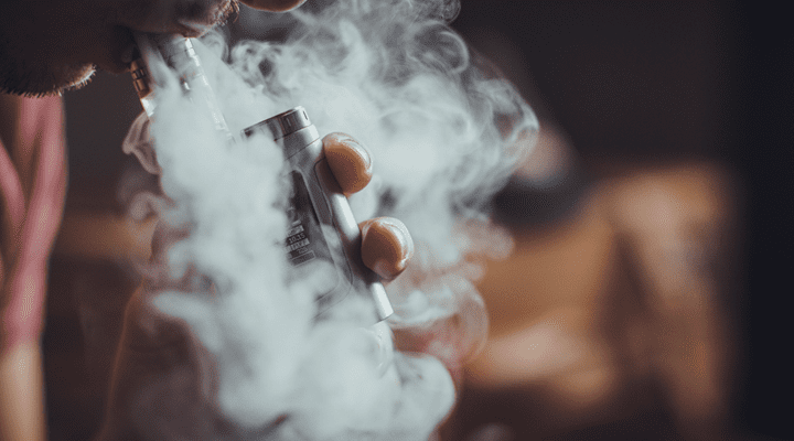 Person smoking a vape.