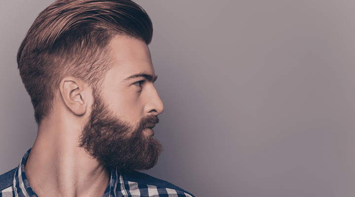Man with a beard looking away from the camera.