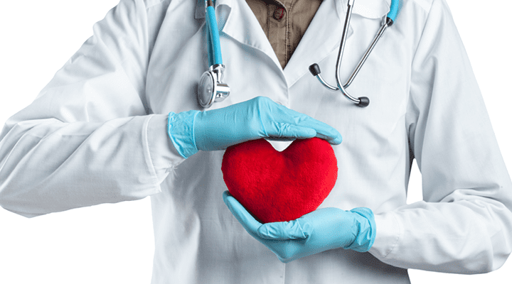 Doctor holding a heart cushion.