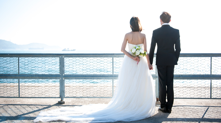 Couple getting married on the water.