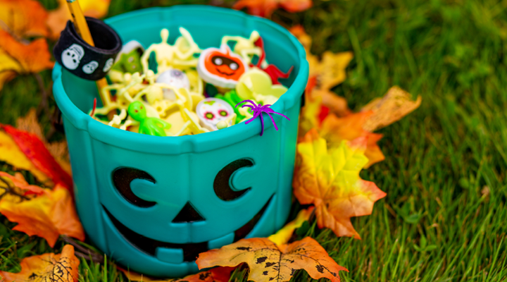 Bucket of halloween candy and toys.