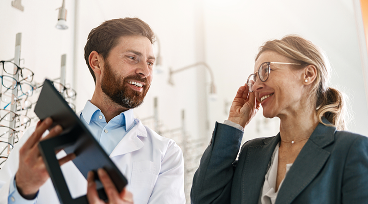 Eye doctor giving a patient a vision exam.